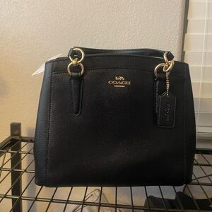 Brand new black coach purse.